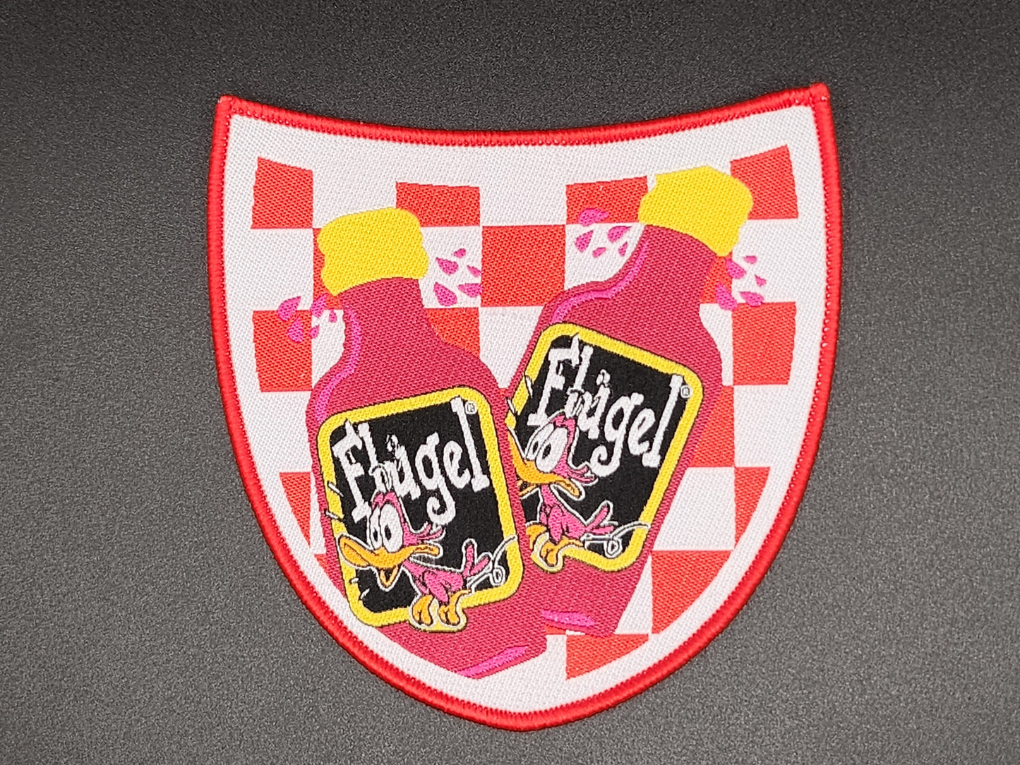 Embleem FLUGEL shot zakje
