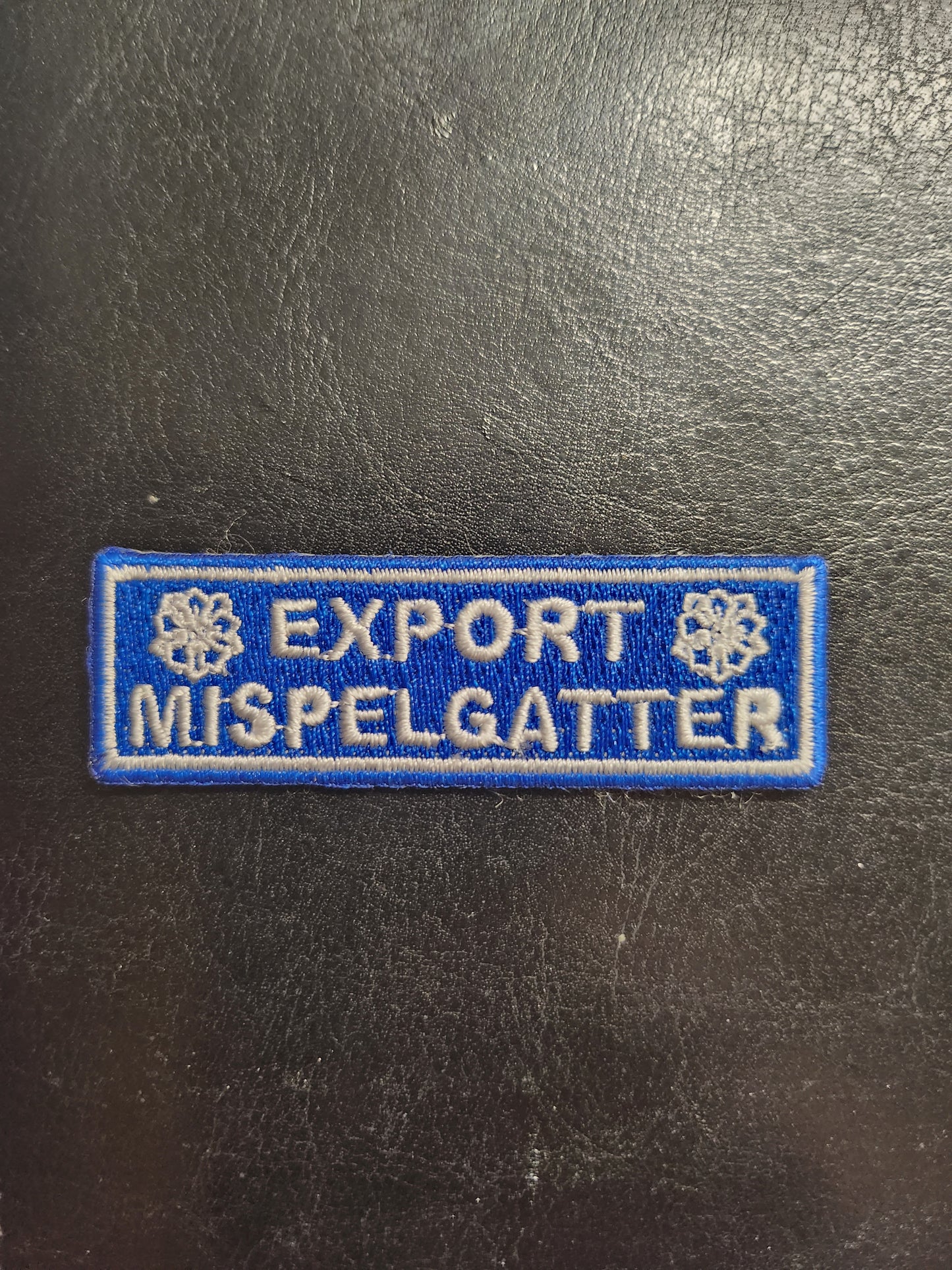 Embleem export-mispelgatter