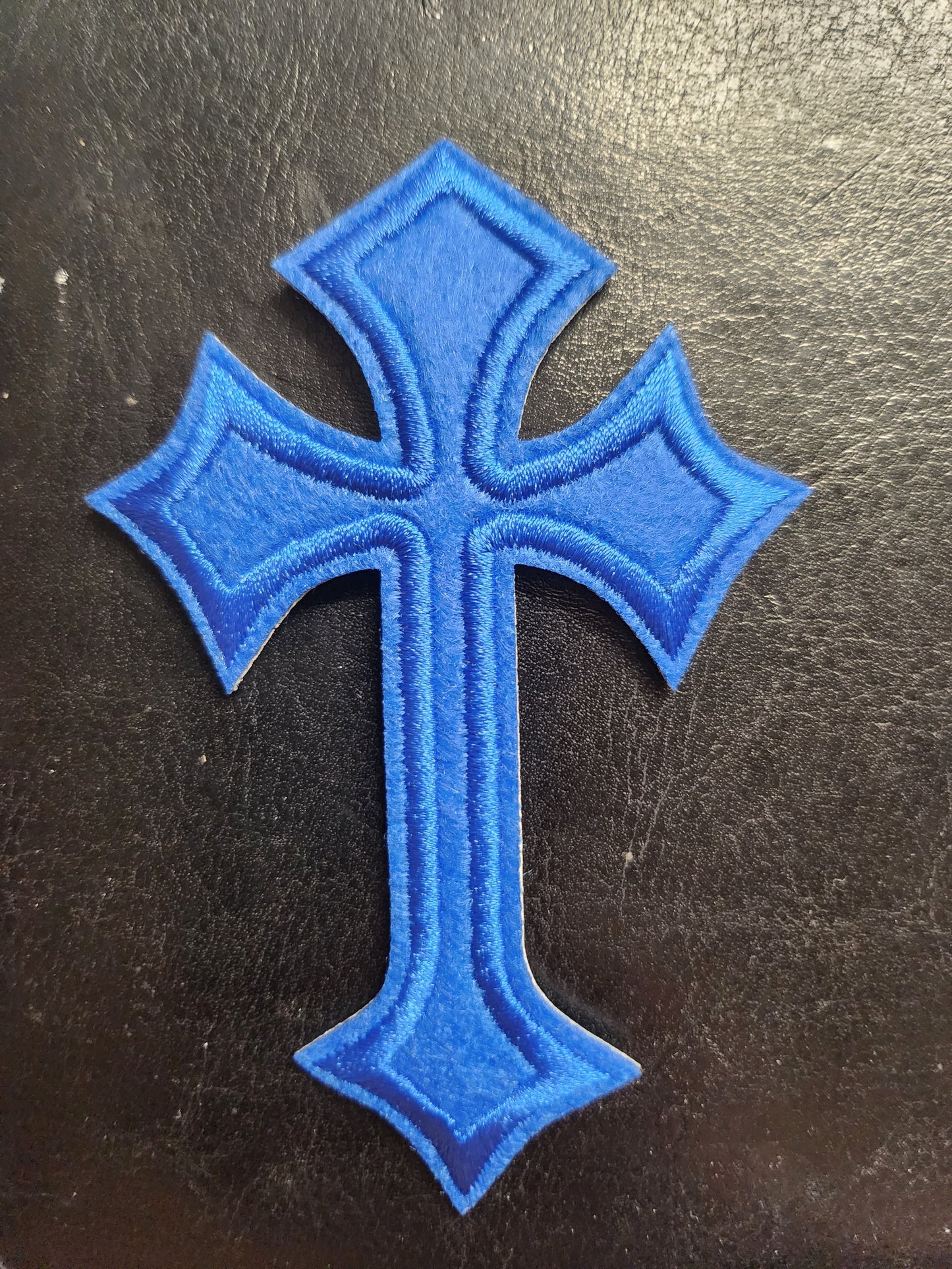 Embleem blauw kruis