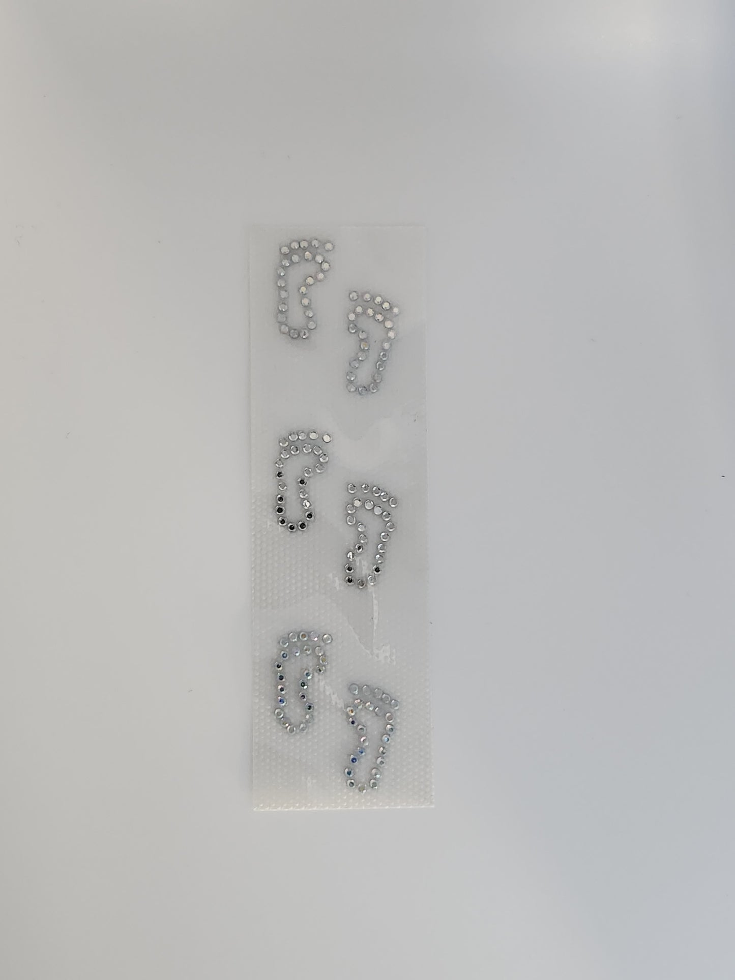 Strass embleem voetjes zilver