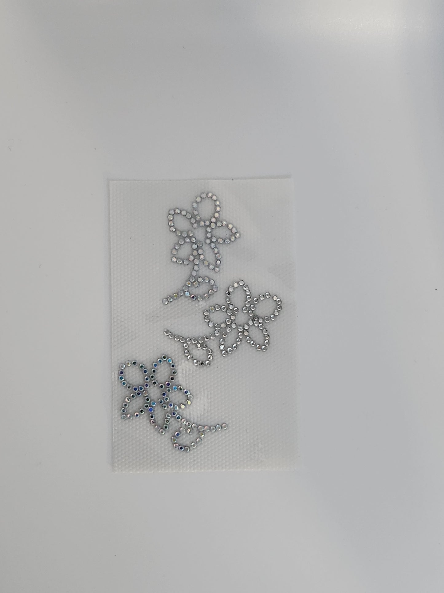 Strass embleem bluumpkes zilver